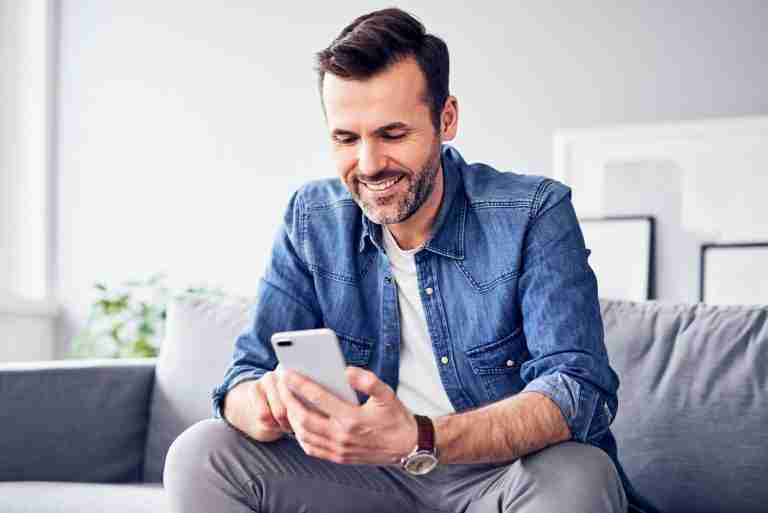 man looking at mobile phone