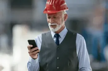 Man using phone at construction site to notarize online
